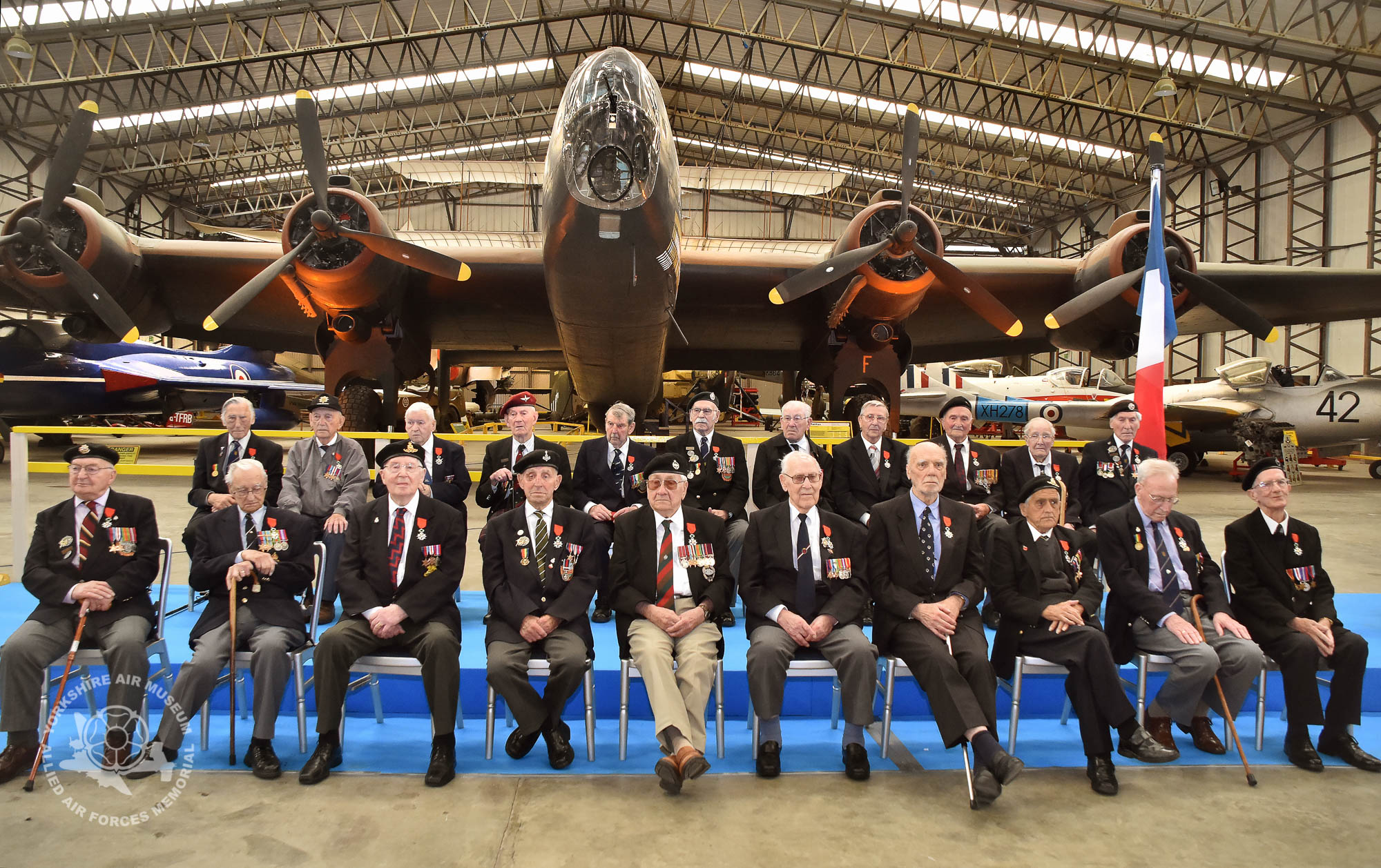 Legion d'Honneur medals presented to 21 Normandy Veterans at Yorkshire Air Museum on Sunday 22nd May, 2016. Pictured front from left are, Albert Edward Barritt, Norman Berryman, Kenneth Charlton, Kenneth Cooke, Douglas Dawson, Reginald Deighton, George Grahm, Dennis James Haydock and James Joseph Healy, with back from left, Horace Hodgson, George Hubert Hollings, Kenneth Alfred Johnson, James Matthew Johnston, Robert Mathieson, Ernest Naylor, Harry Ramsey, Bernard John Richardson, Willie Riley and Kenneth William Smith, all who recieved the medal from Colonel Bruno Cunat, French Liasion Officer to the Ministry of Defence. Picture David Harrison/ Yorkshire Air Museum.