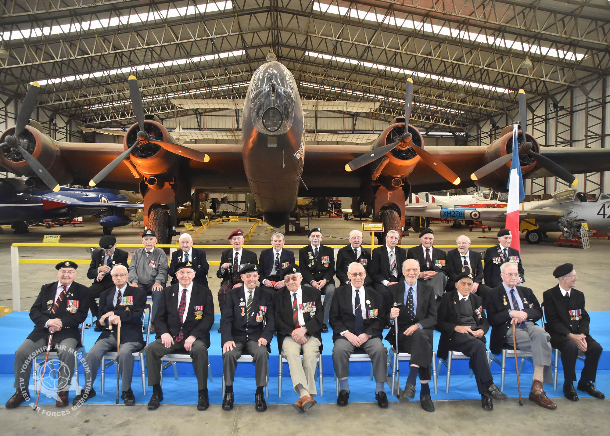 Legion d'Honneur medals presented to 21 Normandy Veterans at Yorkshire Air Museum on Sunday 22nd May, 2016. Pictured front from left are, Albert Edward Barritt, Norman Berryman, Kenneth Charlton, Kenneth Cooke, Douglas Dawson, Reginald Deighton, George Grahm, Dennis James Haydock and James Joseph Healy, with back from left, Horace Hodgson, George Hubert Hollings, Kenneth Alfred Johnson, James Matthew Johnston, Robert Mathieson, Ernest Naylor, Harry Ramsey, Bernard John Richardson, Willie Riley and Kenneth William Smith, all who recieved the medal from Colonel Bruno Cunat, French Liasion Officer to the Ministry of Defence. Picture David Harrison/ Yorkshire Air Museum.
