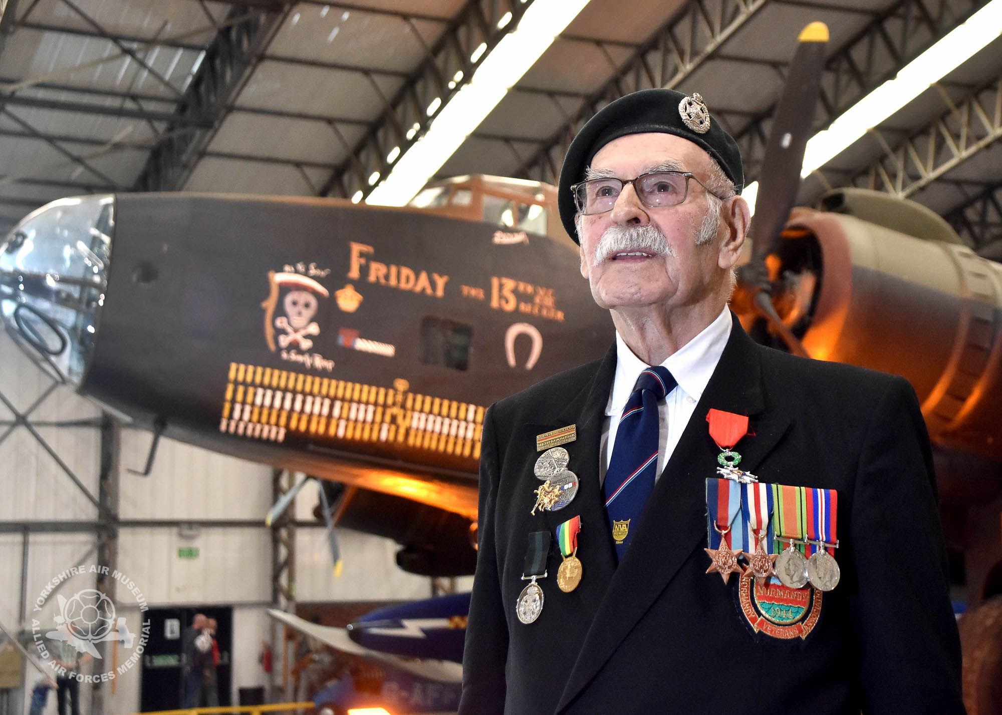 Pictured in front of a Halifax Bomber. Legion d'Honneur medals presented to 21 Normandy Veterans at Yorkshire Air Museum on Sunday 22nd May, 2016. Pictured is George Edward Meredith of Acomb, York, who recieved the medal from Colonel Bruno Cunat, French Liasion Officer to the Ministry of Defence. Picture David Harrison/ Yorkshire Air Museum. (Private in the Army. Dispatch rider with 11th Armoured Division. Served from 7th June until the end of the campaign.)